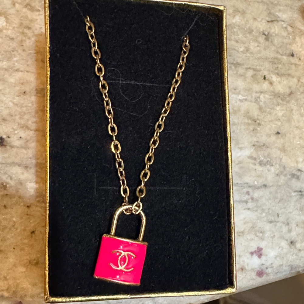 CHANEL Gold Necklace with Vibrant Pink Padlock